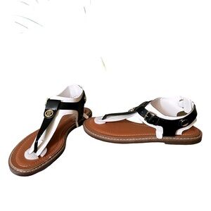 Tommy Hilfiger’s Bennia sandals secure with a back strap and side buckle.
